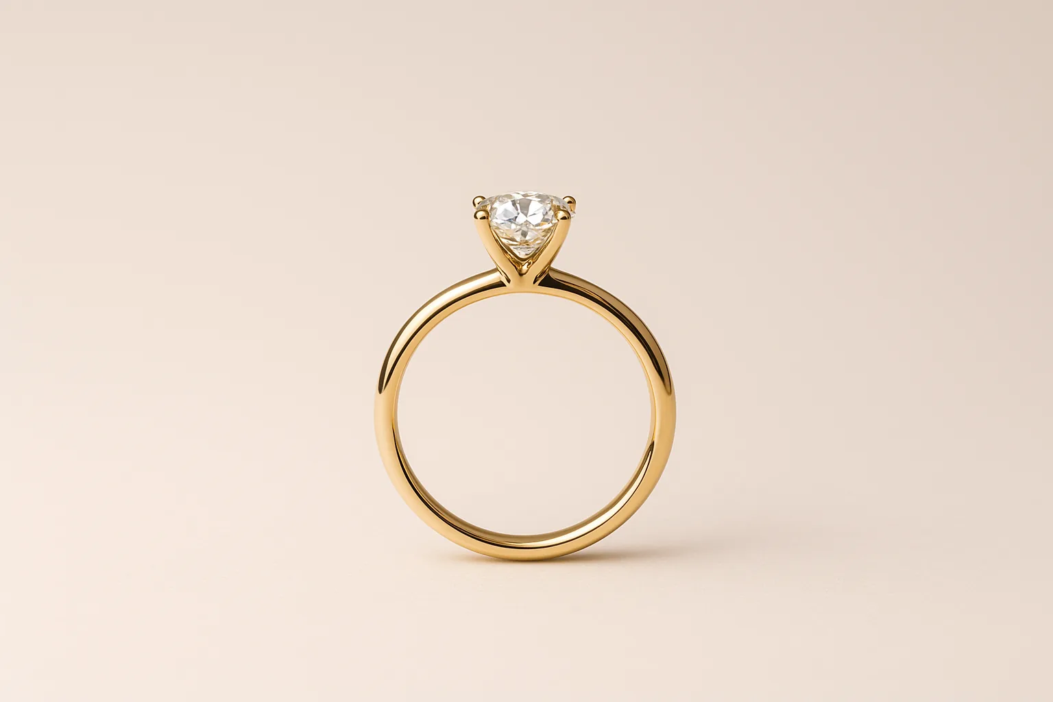 A yellow gold solitaire engagement ring standing upright, its diamond raised in slender prongs.
